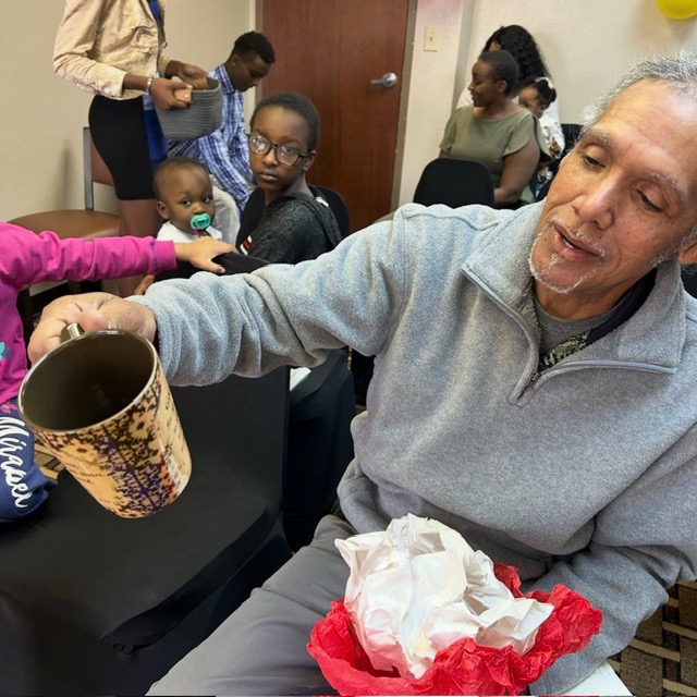 Family receiving goods at the Duluth, GA giveaway